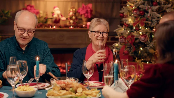 Happy Elder Woman Clinking Glasses Young Person While Enjoying Christmas — Foto Stock