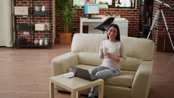 Beautiful Student Sitting Couch Modern Cozy Apartment While Smiling Heartily — Video Stock