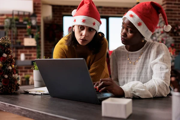Multiethnic Team Women Santa Hat Working Business Laptop Sitting Festive — Photo