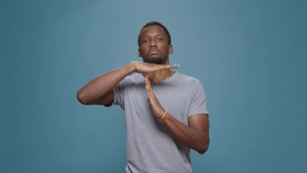 African American Man Doing Timeout Gesture Shape Hands Expressing Half — Stockvideo