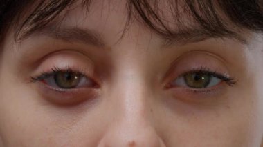 Macro shot authentic portrait of woman with natural skin, beautiful attractive person smiling in front of camera. Female model with positive facial expressions and fresh look. Close up.