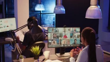 Project manager talking to people on business videoconference call, attending company meeting with webcam on internet network. Using online videocall conference and remote teleconference.