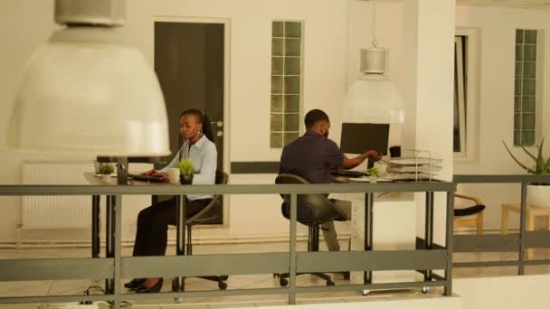 Male Employee Leaving Office Job Waving Colleague Woman Sitting Desk — Vídeos de Stock