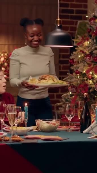 Vertical Video Festive African American Woman Bringing Main Course Table — Vídeos de Stock