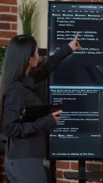 Vertical Video Team Programmers Analyzing Code Wall Screen Looking Bugs — Video