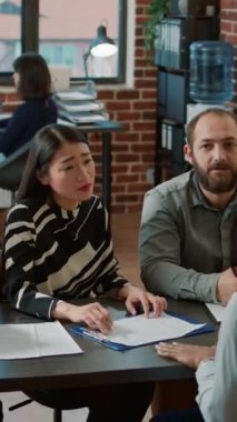 Vertical video: Displeased employee getting fired from business work job, feeling shocked about bad news and unemployment. Jobless upset woman being dismissed from corporate and human resources career