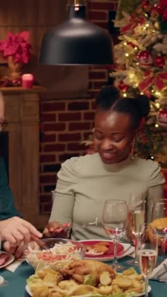 Vertical Video Diverse Festive People Sitting Christmas Dinner Table While — Wideo stockowe