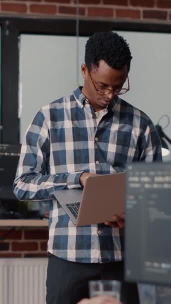 Vertical Video Portrait African American Software Developer Holding Laptop Looking — Stockvideo
