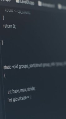 Vertical video Closeup of computer screen of software developer typing programming language in it startup agency. Display concept of system engineer writing source code. Scrolling text of database