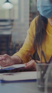 Vertical video: Human resources employee meeting with applicant at job interview in business office. Company worker attending appointment with candidate, having CV and talking about hiring during