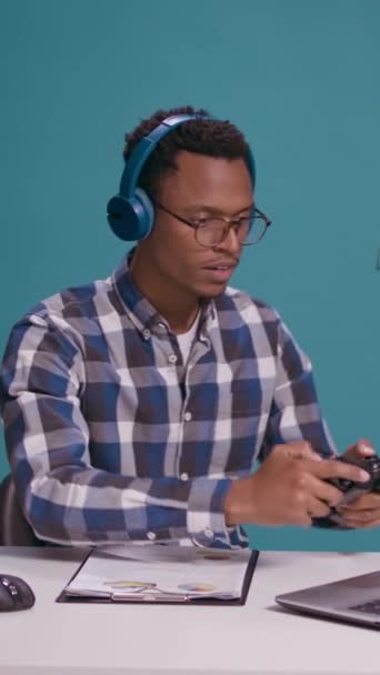 Vertical Video Cheerful Man Playing Video Games Joystick Headphones Using — Stok video