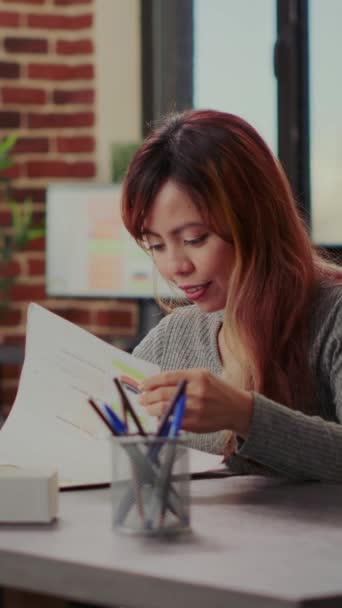 Vertical Video Portrait Asian Woman Analyzing Documents Graphs Startup Office — Αρχείο Βίντεο
