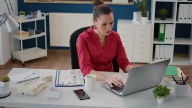Tired stressed accountant feeling angry about project failure, planning financial strategy for business growth. Displeased disappointed woman having problem with sales statistics on laptop.
