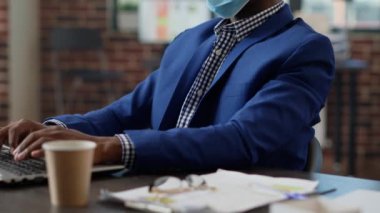 Office employee working on laptop to create business project with statistics and online research. Executive manager using network data to plan startup presentation at job. Close up.