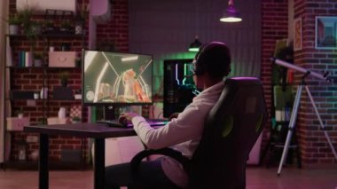 Over shoulder view of gamer streaming multiplayer first person shooter angry after losing online competition on gaming pc. African american playing internet action game unhappy after failing level.