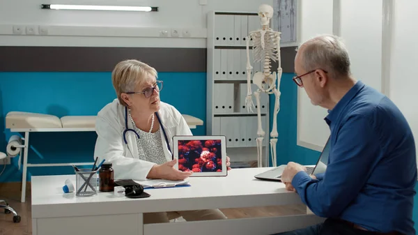 Female Medic Examining Virus Illustration Patient Tablet Screen Talking Coronavirus — 스톡 사진