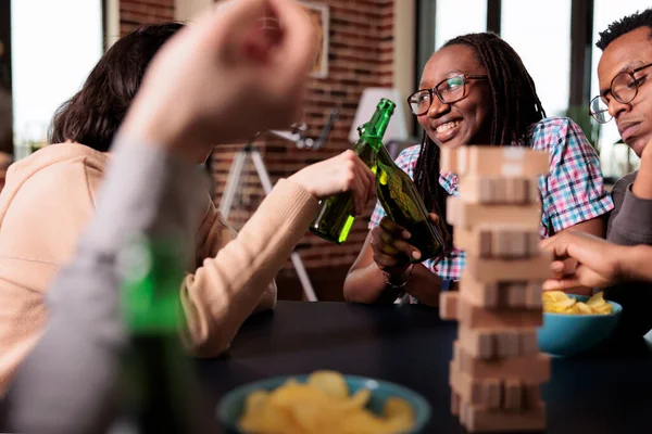 Multicultural Happy Friends Enjoying Drinking Alcoholic Beverage Together While Playing — Fotografia de Stock