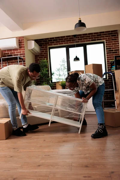 Husband Wife Moving New Apartment Together Unpacking Furniture Decorate Household — стоковое фото