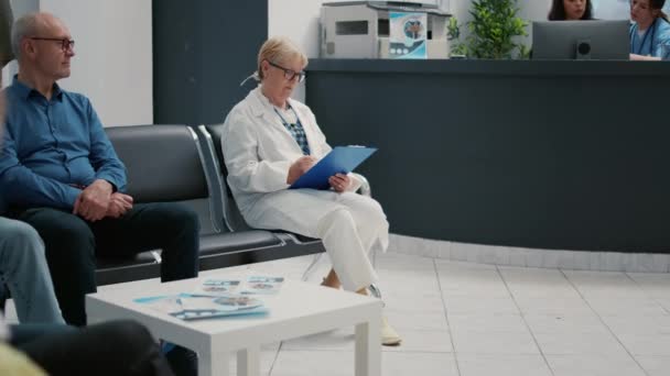 Portrait Senior Woman Doctor Working Checkup Report Waiting Room Hospital — Stock Video