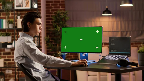Asian Businessman Looking Computer Greenscreen Display Analyzing Isolated Copyspace Mockup — Stok fotoğraf