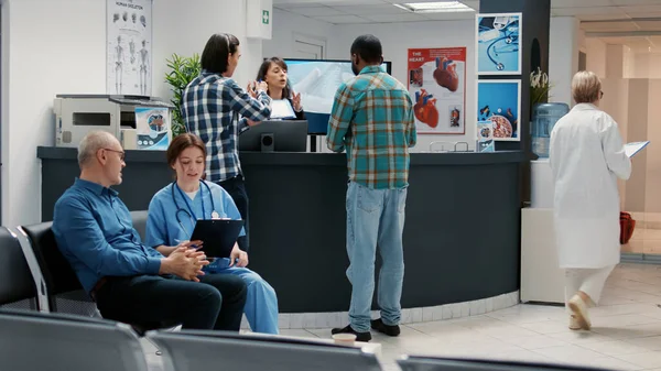 Busy Hospital Reception Desk Diverse People Waiting Room Asian African — 图库照片