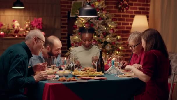 Festive Multiethnic Family Enjoying Christmas Dinner Home While Eating Traditional — Wideo stockowe