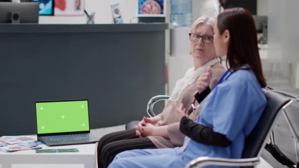 Diverse Women Talking Healthcare Having Greenscreen Laptop Waiting Room Lobby — Αρχείο Βίντεο
