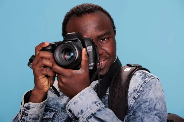 Photography Enthusiast Taking Photo Dslr Camera While Standing Blue Background — Stockfoto