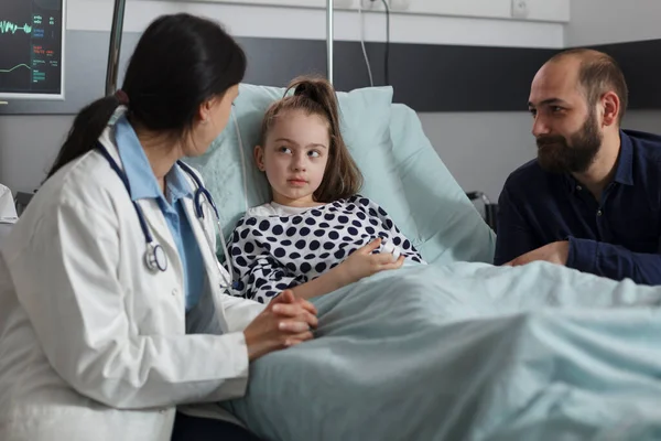 Pediatrician Discussing Sick Little Daughter Resting Patient Bed While Caring —  Fotos de Stock
