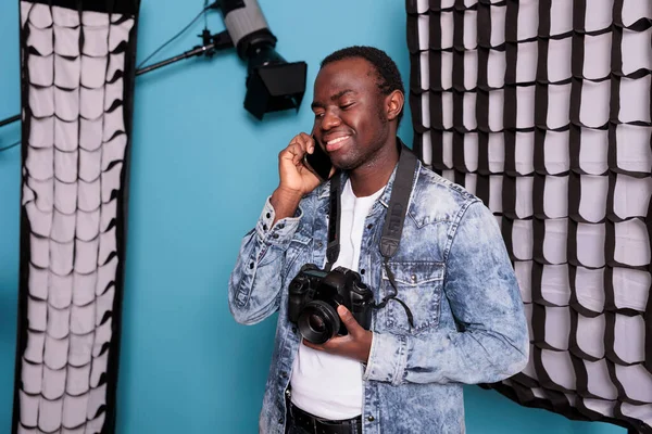 Young Producer Having Phone Call While Working Production Studio Equipped —  Fotos de Stock