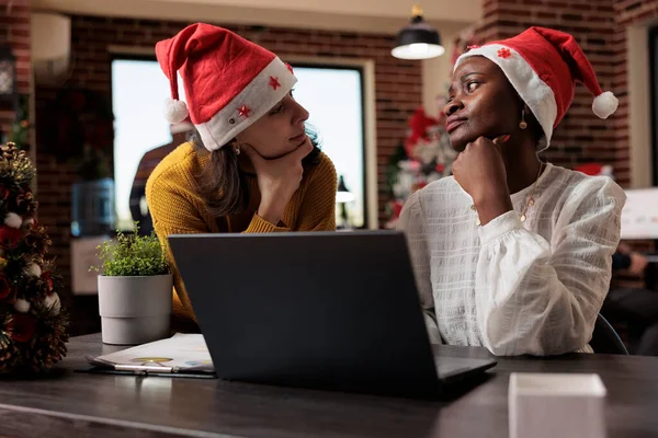 Diverse Team Colleagues Santa Hat Working Business Laptop Sitting Festive — Fotografia de Stock