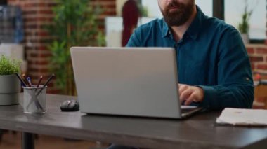 Business man working on successful presentation report with charts and graphs information on documents. Planning professional research analysis with online statistics on laptop.