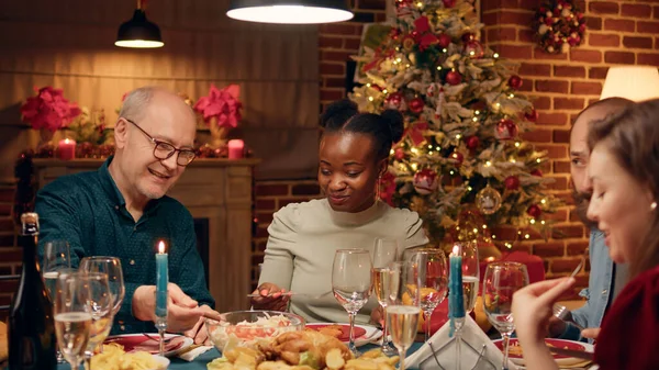 Diverse Festive People Sitting Christmas Dinner Table While Enjoying Seasonal — 图库照片
