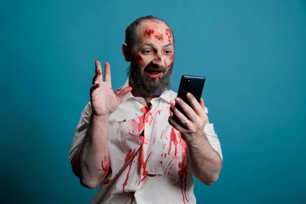 Terrifying Zombie Using Videocall Conference Smartphone Trying Talk Remote Videoconference —  Fotos de Stock