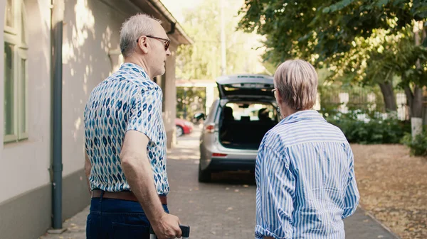 Senior Couple Putting Luggage Car Trunk While Getting Ready Holiday — Stok fotoğraf