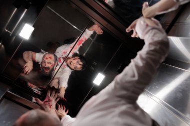 Creepy cruel zombies sitting in elevator and attacking business office to eat brain. Abusive terrifying creepy monsters crawling on walls and trying to escape, walking dead evil massacre.