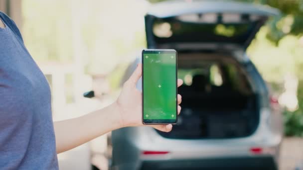 Woman Standing Smartphone Having Green Screen Mockup Display While People — Stock Video