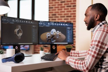 Industrial engineer manufacturing gears product, wokring on technical product construction with creative cad software. Prototyping machinery production and engine model graphics at home.