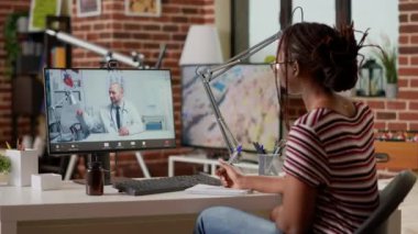 Sick patient talking to doctor on telehealth videocall conference, using computer with webcam to do medical consultation on online videoconference. Remote telemedicine virtual meeting.