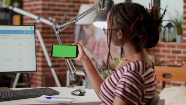 African American Freelancer Using Horizontal Greenscreen Mobile Phone Looking Isolated — Stock video
