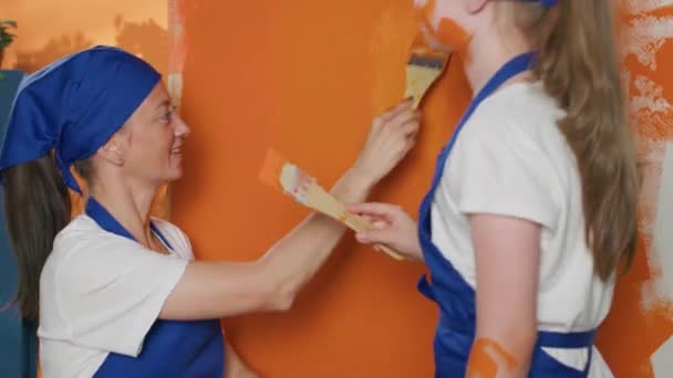 Woman Girl Having Fun Painting Walls Paintbrush Using Orange Color — Stock video