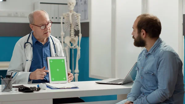 General Practitioner Analyzing Greenscreen Device Patient Hospital Cabinet Looking Isolated — Stockfoto