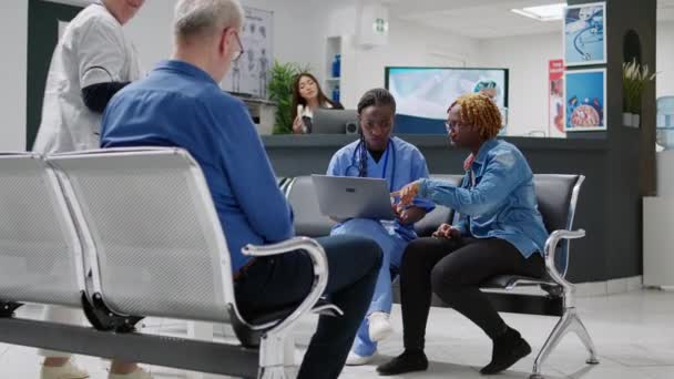 African American Nurse Patient Analyzing Diagnosis Laptop Using Computer Explain — Video Stock