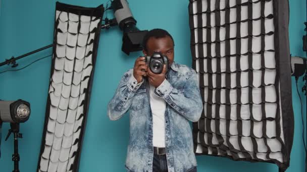 Male Photographer Using Dslr Camera Lens Take Pictures Studio Backstage — Stockvideo
