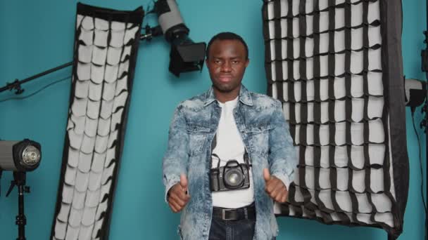 Young Man Showing Thumbs Dislike Gesture Studio Professional Photography Equipment — Vídeo de Stock