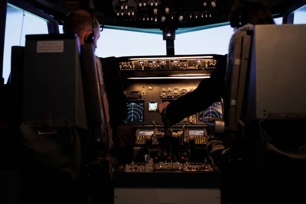 Team Captain Copilot Throttling Engine Fly Airplane Using Control Panel — Photo