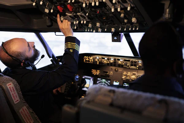 Male Captain Pushing Buttons Start Power Dashboard Control Using Panel — Fotografia de Stock
