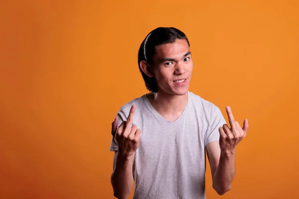 Angry Young Asian Man Showing Middle Fingers Offensive Provocative Behavior — 图库照片