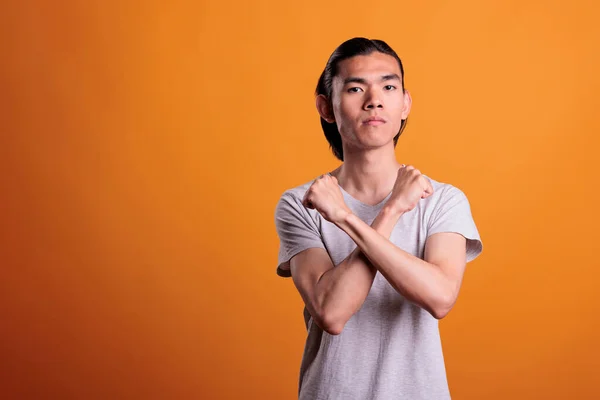 Serious Young Asian Man Showing Stop Gesture Strength Defense Denial — Stock fotografie