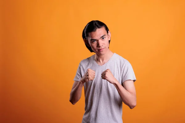 Serious Strong Young Asian Man Standing Fighting Pose Strength Concept — Stock fotografie